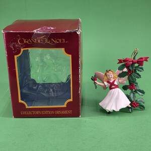 1991 Grandeur Noel Angel Swinging on Holly Christmas Ornament Collectors Edition